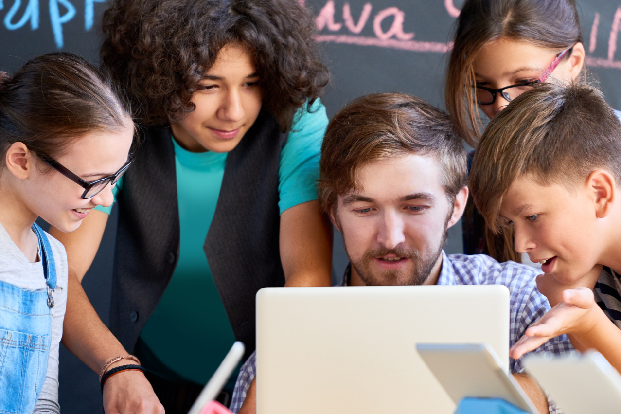 pair of glasses sitting on a row of books